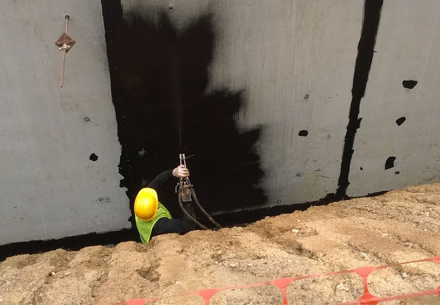 Spray application of rubber waterproofing membrane